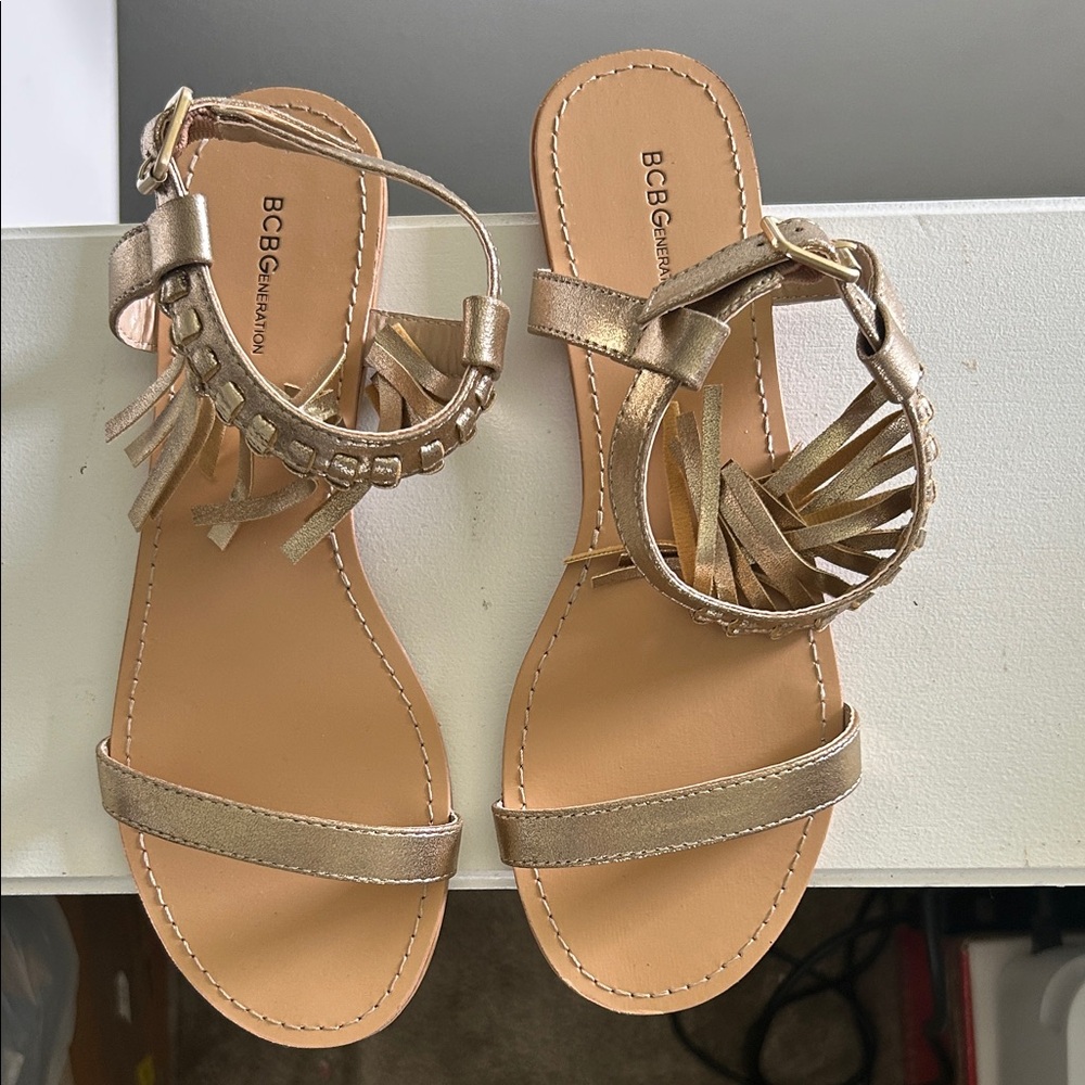 BCBGeneration Metallic Gold Fringe Sandals